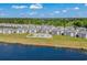 Aerial view of waterfront community with a pool, landscaping, and golf course at 639 Waterway Village Blvd # 14-I, Myrtle Beach, SC 29579