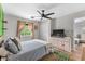 Comfortable bedroom with lots of natural light and a view of the yard at 639 Waterway Village Blvd # 14-I, Myrtle Beach, SC 29579