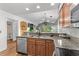 Spacious kitchen with granite countertops and stainless steel dishwasher overlooks the dining and living area at 639 Waterway Village Blvd # 14-I, Myrtle Beach, SC 29579
