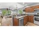 Open kitchen with granite countertops and view into the living area and covered porch at 639 Waterway Village Blvd # 14-I, Myrtle Beach, SC 29579
