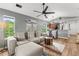 Bright living room with vaulted ceilings, hardwood floors, and comfortable seating at 639 Waterway Village Blvd # 14-I, Myrtle Beach, SC 29579