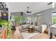 Bright living room with vaulted ceilings, hardwood floors, and comfortable seating at 639 Waterway Village Blvd # 14-I, Myrtle Beach, SC 29579
