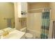 Neutral bathroom with tub, shower, sink and toilet, plus functional white wall cabinets at 690 Riverwalk Dr. # 201, Myrtle Beach, SC 29579