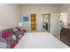 Bedroom showcasing an ensuite bathroom and a mirrored closet at 690 Riverwalk Dr. # 201, Myrtle Beach, SC 29579