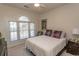 Well-lit bedroom with a large window offering plenty of natural light at 690 Riverwalk Dr. # 201, Myrtle Beach, SC 29579