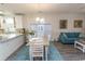 Open dining room featuring hardwood floors, a chandelier, and views of the kitchen and living area at 690 Riverwalk Dr. # 201, Myrtle Beach, SC 29579