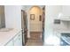 Galley kitchen featuring hardwood floors and modern appliances at 690 Riverwalk Dr. # 201, Myrtle Beach, SC 29579