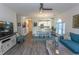 Open-concept living area with wood floors flowing into the dining and kitchen areas at 690 Riverwalk Dr. # 201, Myrtle Beach, SC 29579