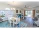 Bright living room featuring hardwood floors, a ceiling fan, and access to an outdoor patio at 690 Riverwalk Dr. # 201, Myrtle Beach, SC 29579