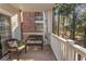 Comfortable patio seating with views of the surrounding trees and building architecture at 690 Riverwalk Dr. # 201, Myrtle Beach, SC 29579