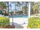 Relaxing community pool area surrounded by lush landscaping, offering a peaceful retreat at 690 Riverwalk Dr. # 201, Myrtle Beach, SC 29579