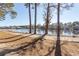 Scenic water view showing a walking path and neighborhood across the lake at 690 Riverwalk Dr. # 201, Myrtle Beach, SC 29579