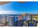 Breathtaking ocean view from balcony with chairs and black metal railing at 7100 N Ocean Blvd. # 1421, Myrtle Beach, SC 29572