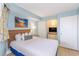 Comfortable bedroom features a wooden headboard, a bedside table, and a wall mounted TV at 7100 N Ocean Blvd. # 1421, Myrtle Beach, SC 29572