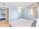 Light and airy bedroom showcasing a bed with blue accents, neutral walls, and bright natural light at 7100 N Ocean Blvd. # 1421, Myrtle Beach, SC 29572