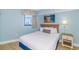 Cozy bedroom with one bed, modern furnishings and calming decor at 7100 N Ocean Blvd. # 1421, Myrtle Beach, SC 29572