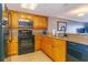 Well-equipped kitchen featuring granite countertops, stainless steel appliances, and ample cabinet space at 7100 N Ocean Blvd. # 1421, Myrtle Beach, SC 29572