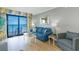 Cozy living room featuring stylish furniture, decor, and a balcony with ocean views at 7100 N Ocean Blvd. # 1421, Myrtle Beach, SC 29572
