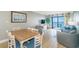 Open floor plan in the living and dining area featuring attractive furniture and ocean views at 7100 N Ocean Blvd. # 1421, Myrtle Beach, SC 29572