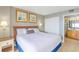 Comfortable bedroom featuring a king-size bed, closet, and ensuite bathroom at 7100 N Ocean Blvd. # 1421, Myrtle Beach, SC 29572