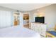 Comfortable bedroom featuring a dresser, closet, and access to ensuite bathroom and kitchen at 7100 N Ocean Blvd. # 1421, Myrtle Beach, SC 29572