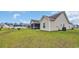 Expansive backyard with a screened porch, lush lawn and views of the surrounding neighborhood at 716 Weston Dr., Conway, SC 29526