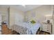Inviting bedroom with a ceiling fan, floral bedspread, and an adjacent white dresser at 716 Weston Dr., Conway, SC 29526