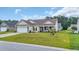 Attractive one-story house with a manicured lawn, tidy landscaping, and an attached two-car garage at 716 Weston Dr., Conway, SC 29526