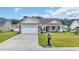 Charming single-story home featuring a brick-accented facade, attached garage and well-maintained landscaping at 716 Weston Dr., Conway, SC 29526