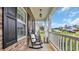 Relaxing front porch featuring rocking chairs and views of the serene neighborhood at 716 Weston Dr., Conway, SC 29526