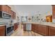Well-equipped kitchen featuring wood cabinets, stainless steel appliances, and granite counters at 716 Weston Dr., Conway, SC 29526