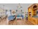 Spacious living room with hardwood floors, comfortable seating, and a large built-in bookcase at 716 Weston Dr., Conway, SC 29526
