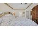 Bedroom featuring a four-poster bed, a ceiling fan, and wood floors at 716 Weston Dr., Conway, SC 29526