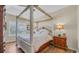 Comfortable bedroom with a four-poster bed and natural light at 716 Weston Dr., Conway, SC 29526