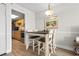 Cozy dining area with seating for four, adjacent to the kitchen and living room at 7200 N Ocean Blvd. # 553, Myrtle Beach, SC 29572