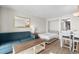 Comfortable living space with sofa, murphy bed, and dining area at 7200 N Ocean Blvd. # 553, Myrtle Beach, SC 29572