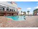 Beautiful outdoor pool area with lounge chairs and building in the background at 7200 N Ocean Blvd. # 553, Myrtle Beach, SC 29572