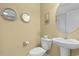 Charming powder room with decorative mirrors, pedestal sink and tan walls at 788 Gabreski Ln. # B4, Myrtle Beach, SC 29577
