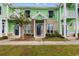 Inviting two-story home with brick accents and green siding at 788 Gabreski Ln. # B4, Myrtle Beach, SC 29577