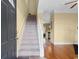 Inviting foyer with hardwood floors, a carpeted staircase, and a view into the kitchen at 788 Gabreski Ln. # B4, Myrtle Beach, SC 29577