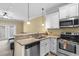 Stylish kitchen with granite countertops, stainless steel appliances, and a breakfast bar at 788 Gabreski Ln. # B4, Myrtle Beach, SC 29577