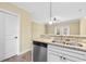 Open-concept kitchen with stainless appliances, granite counters, and a seamless flow at 788 Gabreski Ln. # B4, Myrtle Beach, SC 29577