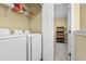 Efficient laundry room with modern appliances and storage shelves at 788 Gabreski Ln. # B4, Myrtle Beach, SC 29577