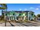 Charming townhouses with a vibrant green exterior, black shutters and manicured landscaping at 788 Gabreski Ln. # B4, Myrtle Beach, SC 29577