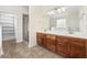 Bathroom featuring double sink vanity, tile floors, a glass enclosed shower and a walk in closet at 837 Sand Binder Dr., Myrtle Beach, SC 29579