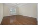 Spacious bedroom featuring hardwood floors, natural light, and neutral paint, creating a serene atmosphere at 837 Sand Binder Dr., Myrtle Beach, SC 29579