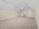 Large bonus room featuring neutral carpet, paint, and ceiling fan at 837 Sand Binder Dr., Myrtle Beach, SC 29579