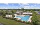 Aerial of the community pool area, showcasing a large swimming pool, lounge chairs, and landscaping at 837 Sand Binder Dr., Myrtle Beach, SC 29579