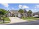 Attractive one-story home with brick and vinyl siding, a well-kept lawn and mature landscaping at 837 Sand Binder Dr., Myrtle Beach, SC 29579