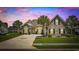 Charming home featuring a well-manicured lawn, a double-wide driveway and mature palm trees at 837 Sand Binder Dr., Myrtle Beach, SC 29579